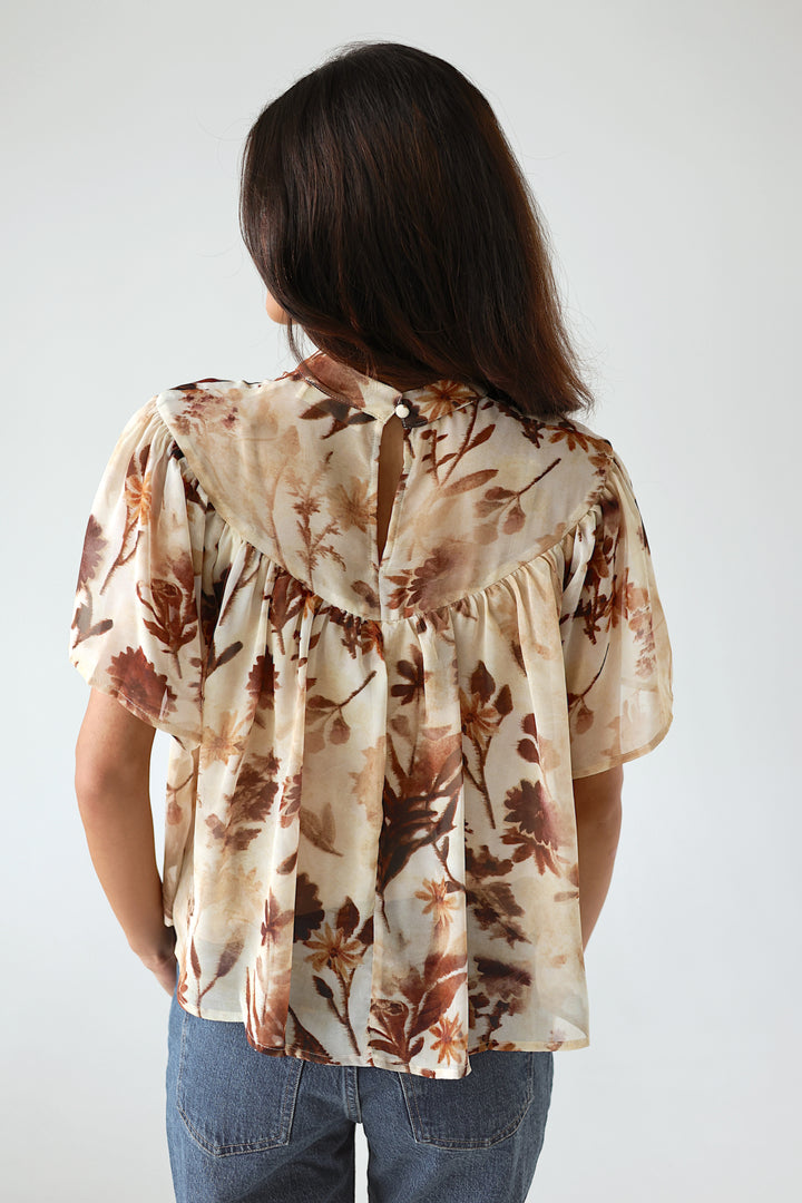 Back view of the Florence floral blouse showing its relaxed flowy silhouette