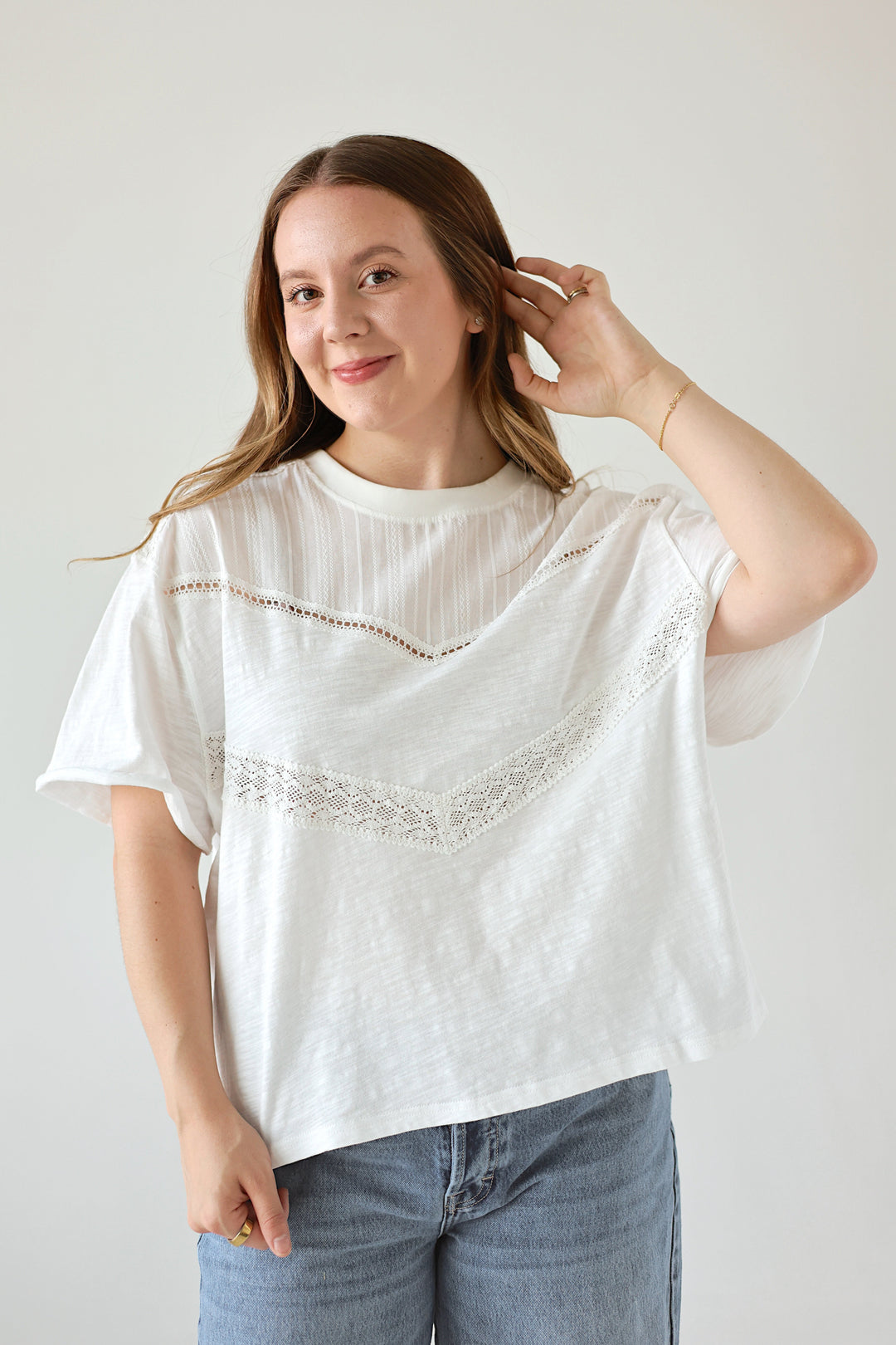 Model wearing the Camille white lace detail top with an oversized relaxed fit