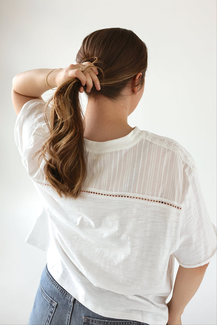 Back view of the Camille white lace detail top showing its oversized silhouette