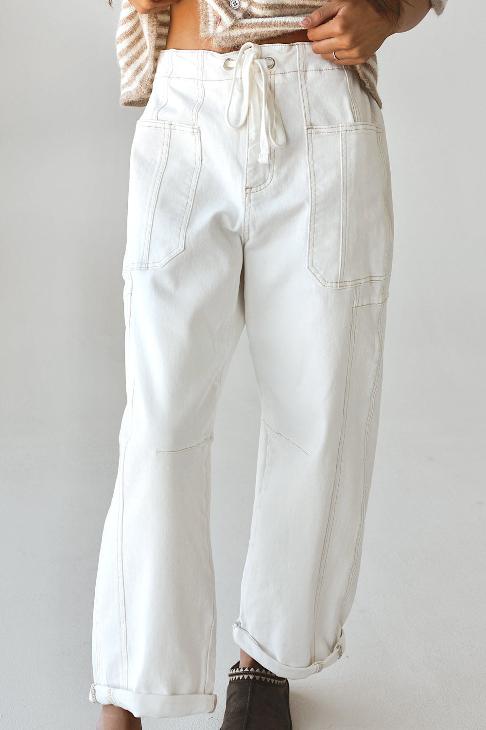 Bacio & Co. white barrel denim pants with drawstring waist, close-up detail front full length view